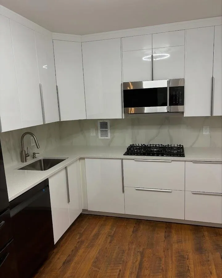 Restored kitchen with white cabinets after water damage in East Camden